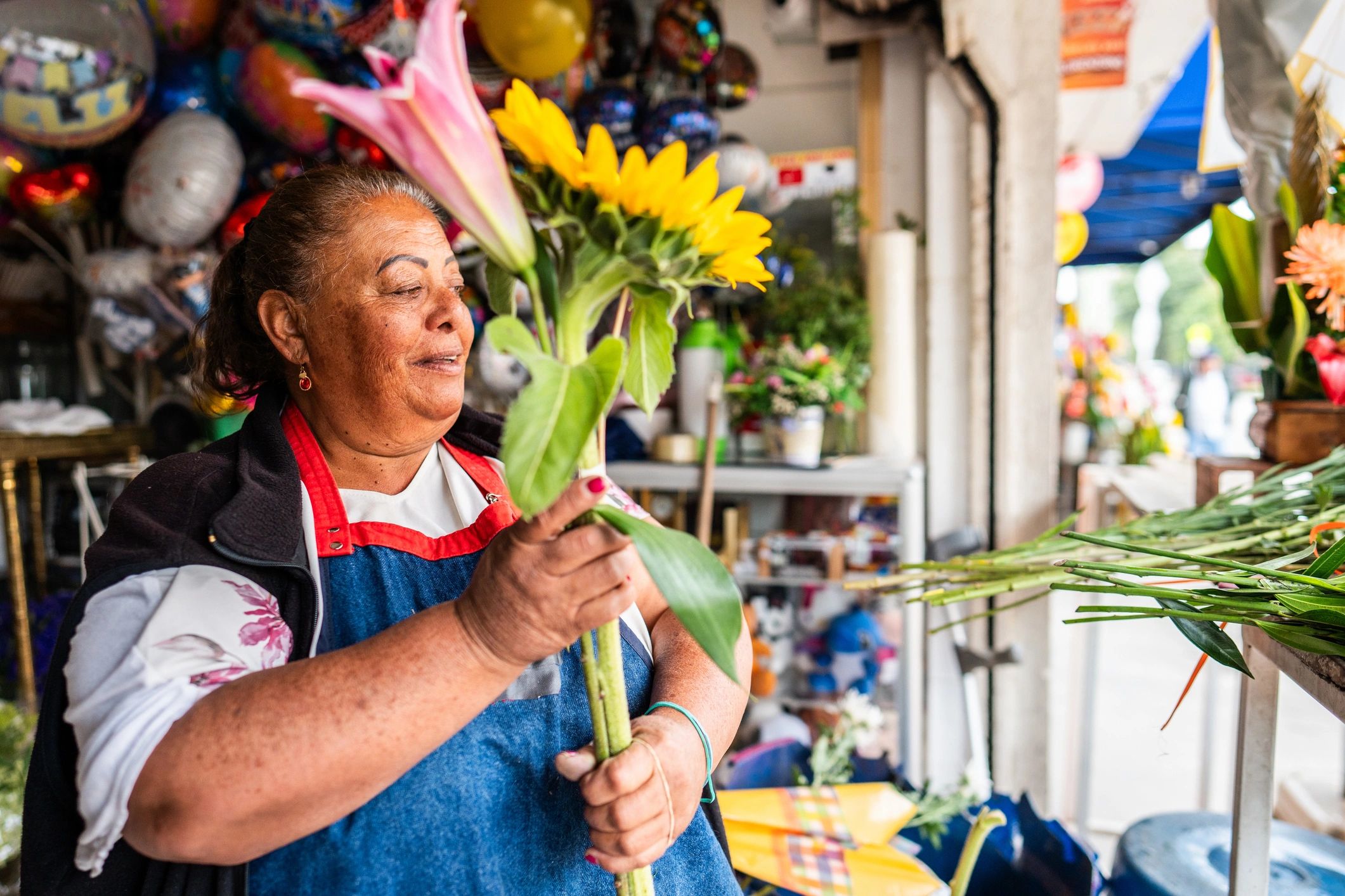 Florist arranging flowers inside a flower shop